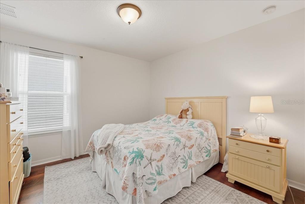 11675 Snail Kite Way Windermere, FL 34786 - Photo 35 of 46 a bedroom with a bed and a window