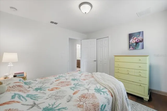 a bathroom with double vanity sinks and a mirror