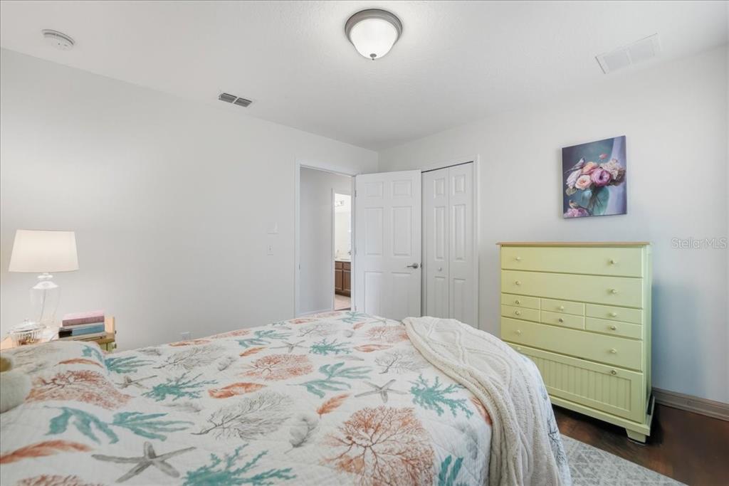 11675 Snail Kite Way Windermere, FL 34786 - Photo 36 of 46 a bedroom with a bed and a cabinets