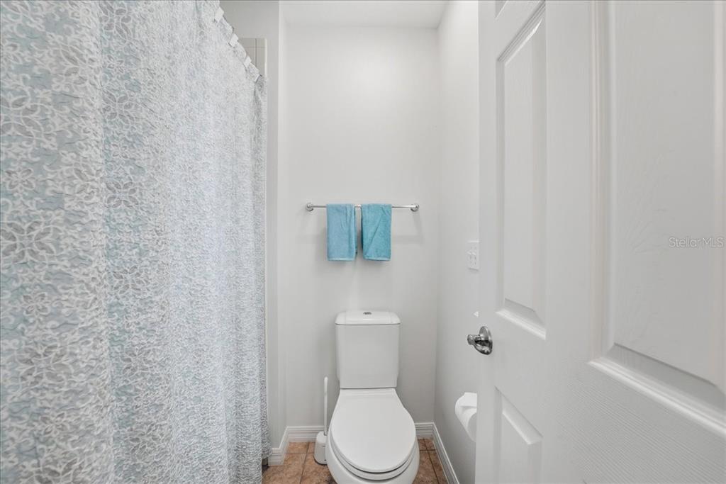 11675 Snail Kite Way Windermere, FL 34786 - Photo 38 of 46 a white toilet sitting next to a shower