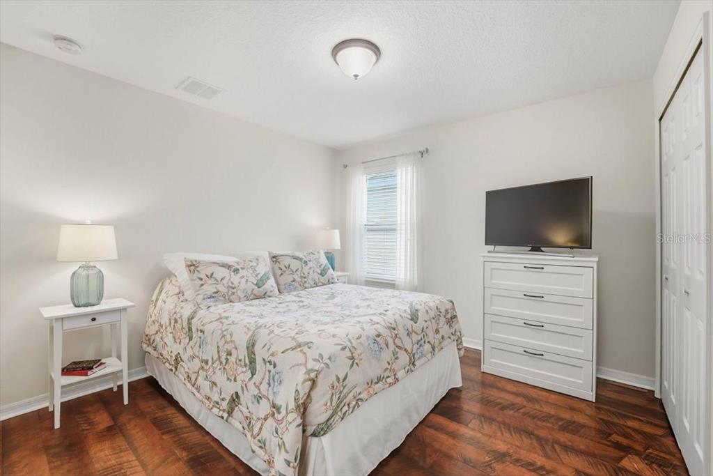 11675 Snail Kite Way Windermere, FL 34786 - Photo 39 of 46 a bedroom with a bed and a flat screen tv