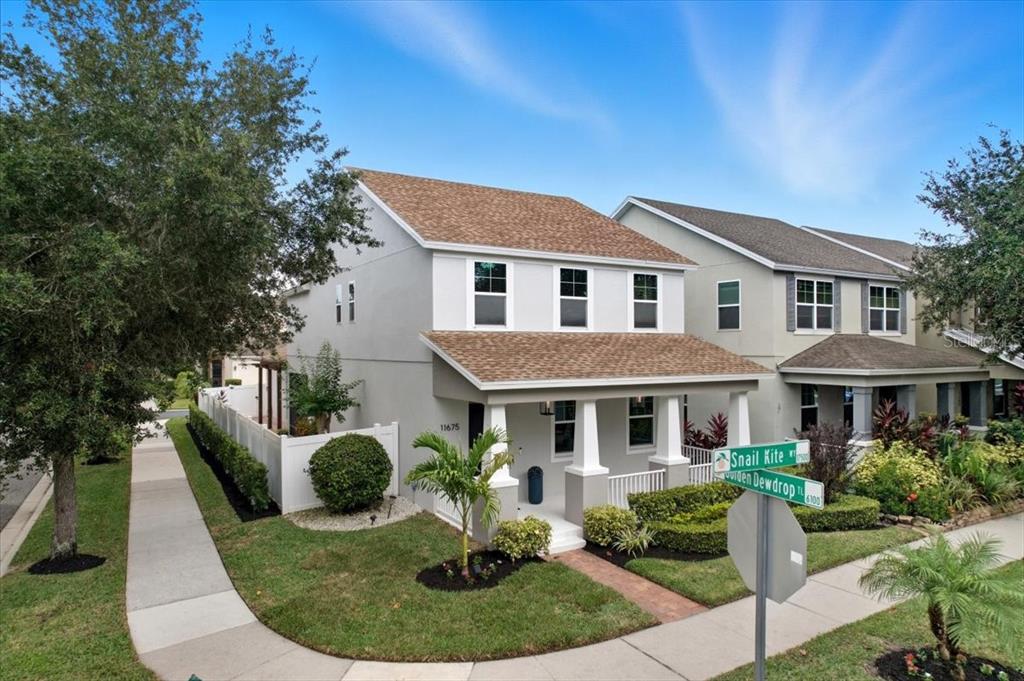 11675 Snail Kite Way Windermere, FL 34786 - Photo 6 of 46 a front view of a house with a yard