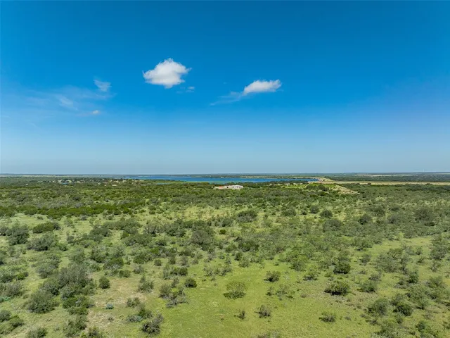 a view of a yard with an ocean