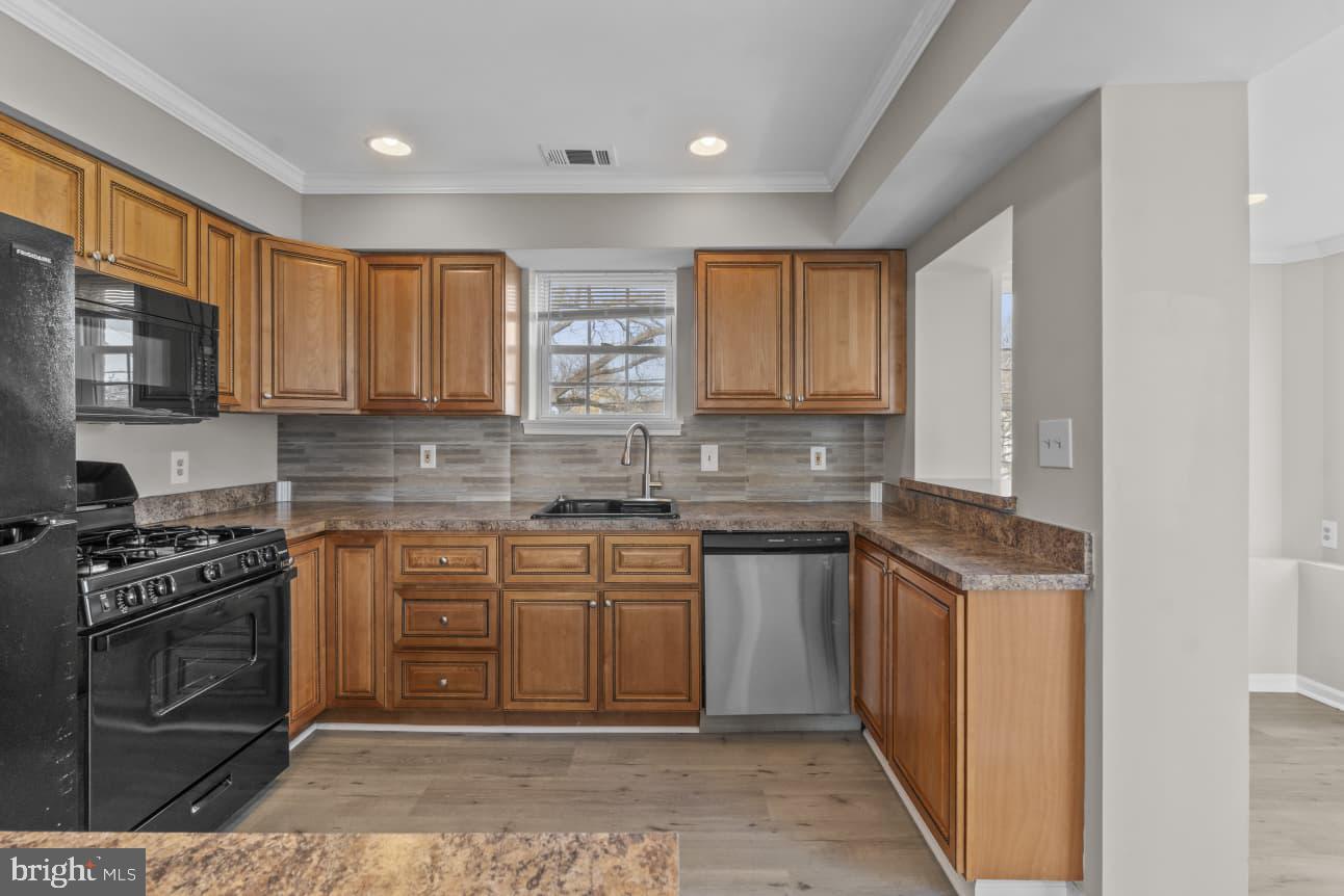 2528 Wendover Road, Unit B Baltimore, MD 21234 - Photo 16 of 22 Modern kitchen with warm wood tones.