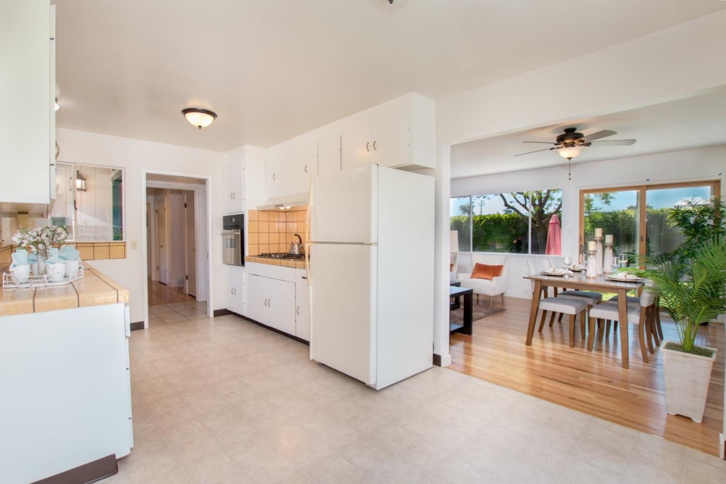 754 Ridge Rd. Santa Clara, CA 95051 - Photo 13 of 25 a view of kitchen with furniture and refrigerator