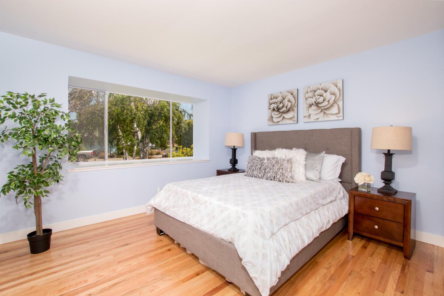 754 Ridge Rd. Santa Clara, CA 95051 - Photo 15 of 25 a bedroom with a bed and a potted plant