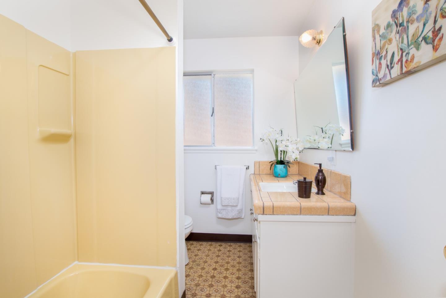 754 Ridge Rd. Santa Clara, CA 95051 - Photo 17 of 25 a bathroom with a sink a toilet and a shower