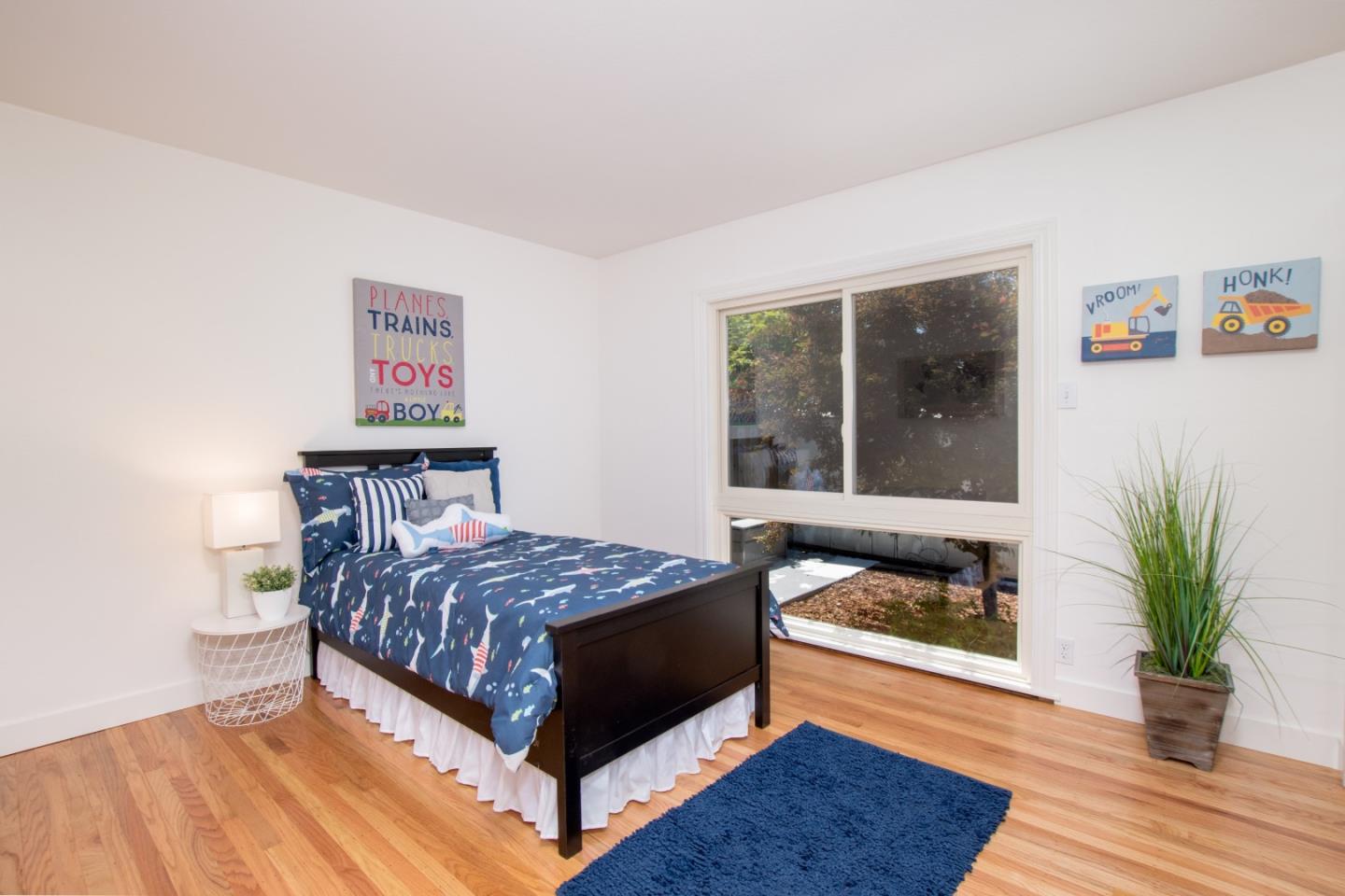 754 Ridge Rd. Santa Clara, CA 95051 - Photo 18 of 25 a bedroom with a bed and a potted plant