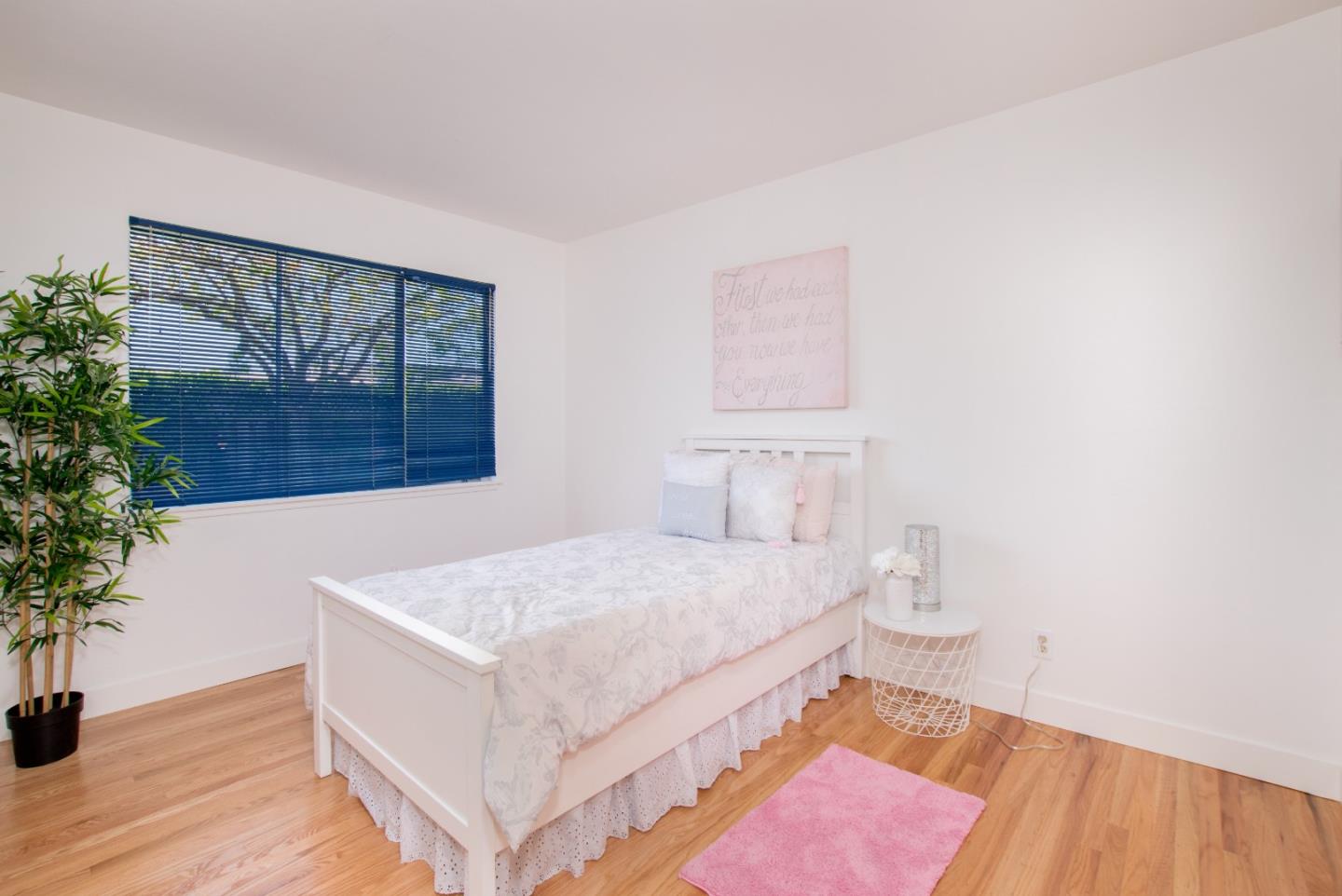 754 Ridge Rd. Santa Clara, CA 95051 - Photo 21 of 25 a bedroom with a bed and a potted plant