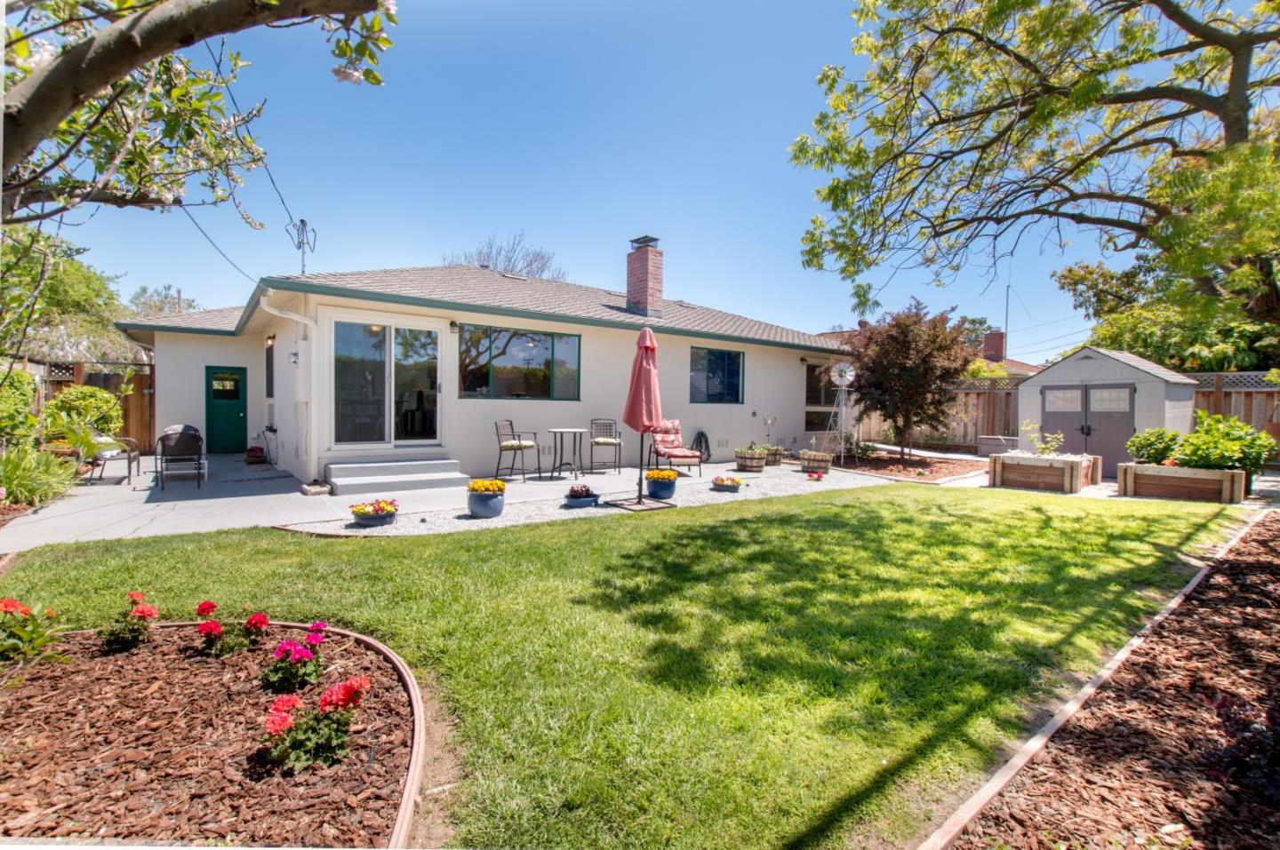 754 Ridge Rd. Santa Clara, CA 95051 - Photo 22 of 25 a front view of a house with sitting area and garden