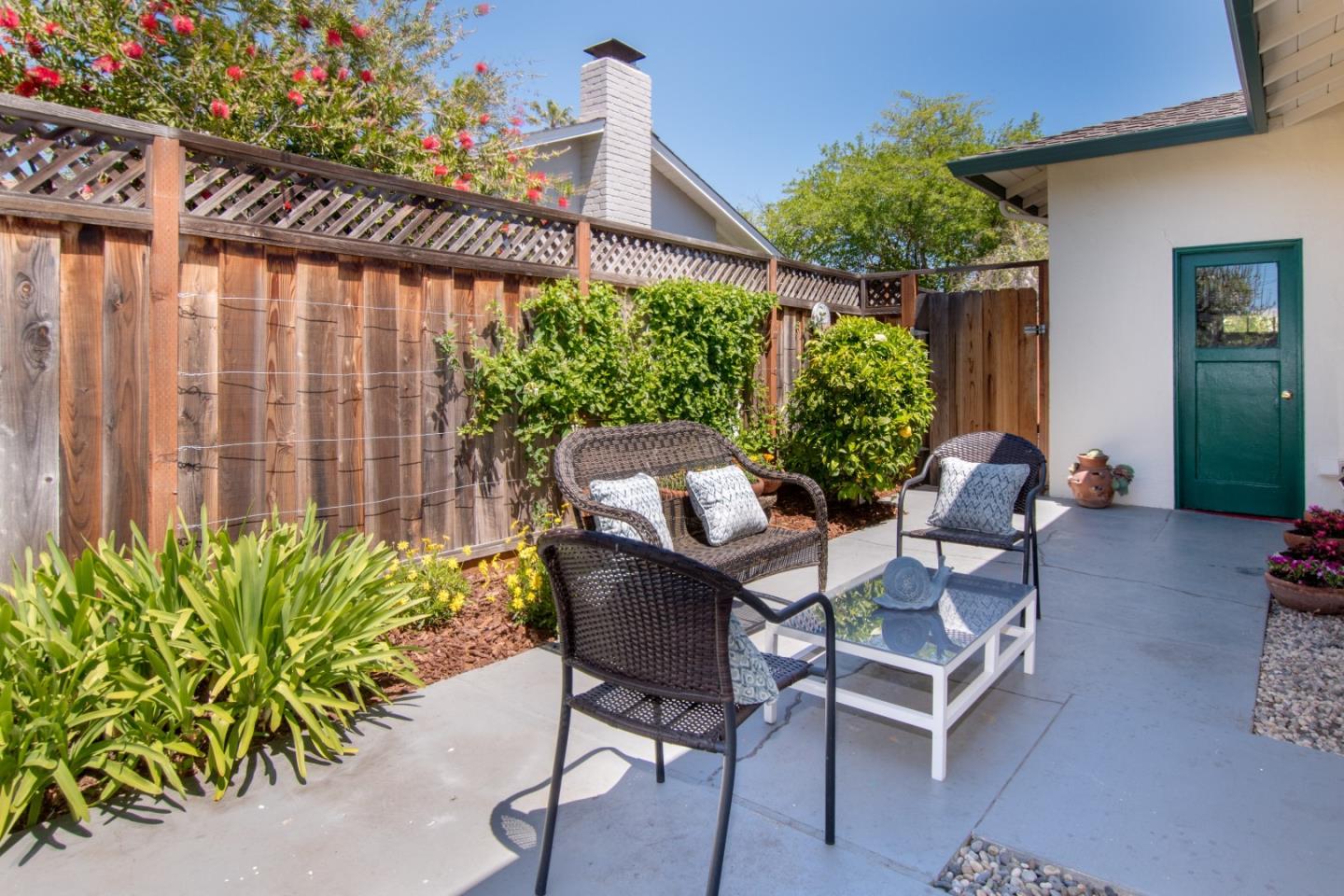 754 Ridge Rd. Santa Clara, CA 95051 - Photo 24 of 25 a patio with table and chairs and potted plants