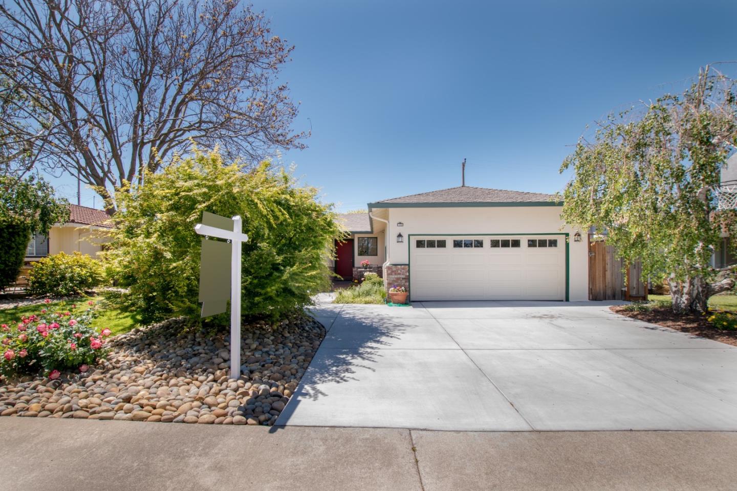 754 Ridge Rd. Santa Clara, CA 95051 - Photo 4 of 25 a front view of a house with a yard and garage