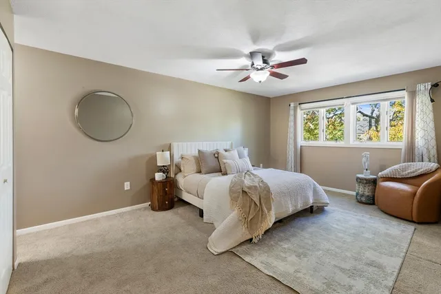 a bed room with bed and window