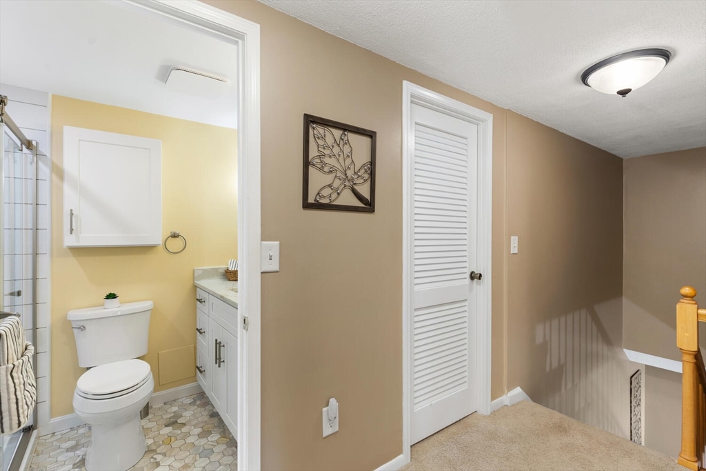1100 Salem Street, Unit 58 Peabody, MA 01960 - Photo 25 of 36 a bathroom with a toilet sink and shower