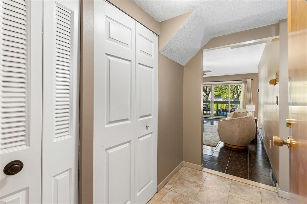 1100 Salem Street, Unit 58 Peabody, MA 01960 - Photo 30 of 36 a living room with furniture and a window