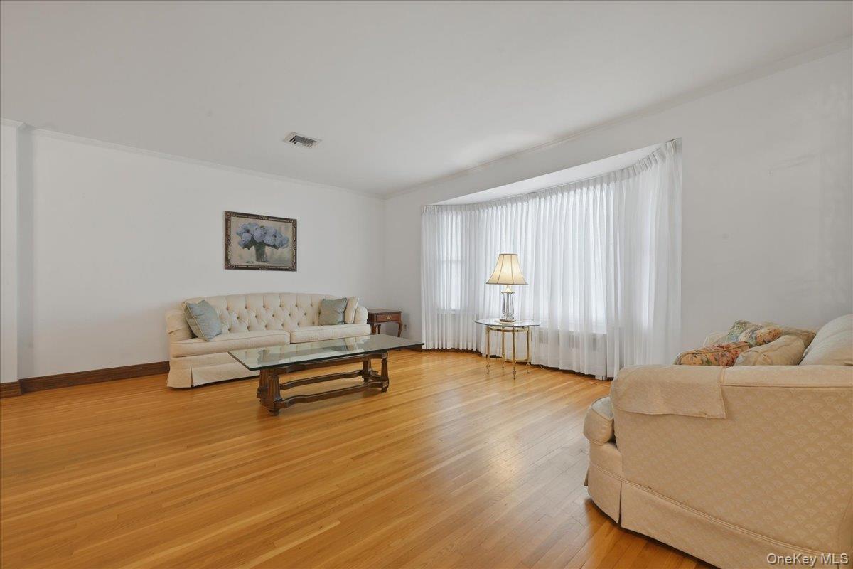 17 Avon Road Farmingdale, NY 11735 - Photo 4 of 46 a living room with furniture and a wooden floor