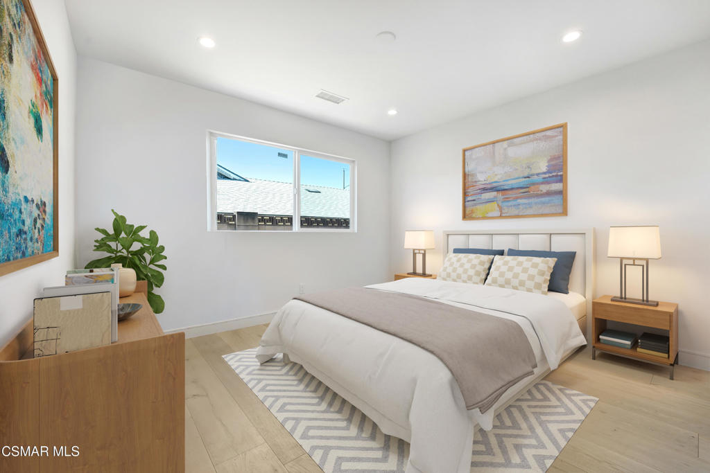 2718 Licia Place Simi Valley, CA 93065 - Photo 12 of 22 a spacious bedroom with a bed and a potted plant