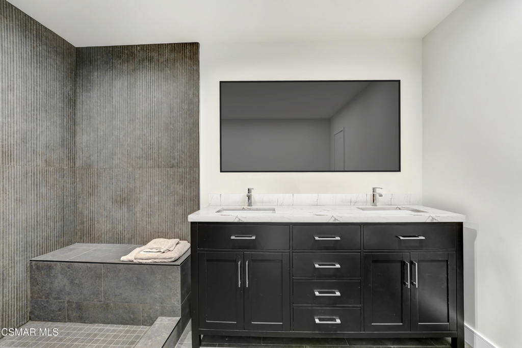 2718 Licia Place Simi Valley, CA 93065 - Photo 14 of 22 a bathroom with a granite countertop sink a toilet and a mirror