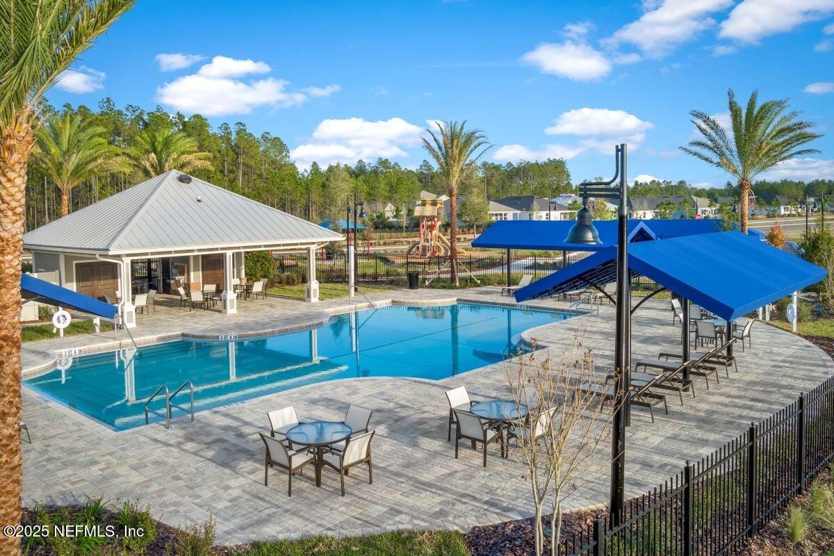 10961 Stapleton Drive Jacksonville, FL 32222 - Photo 11 of 13 a view of a house with swimming pool and sitting area