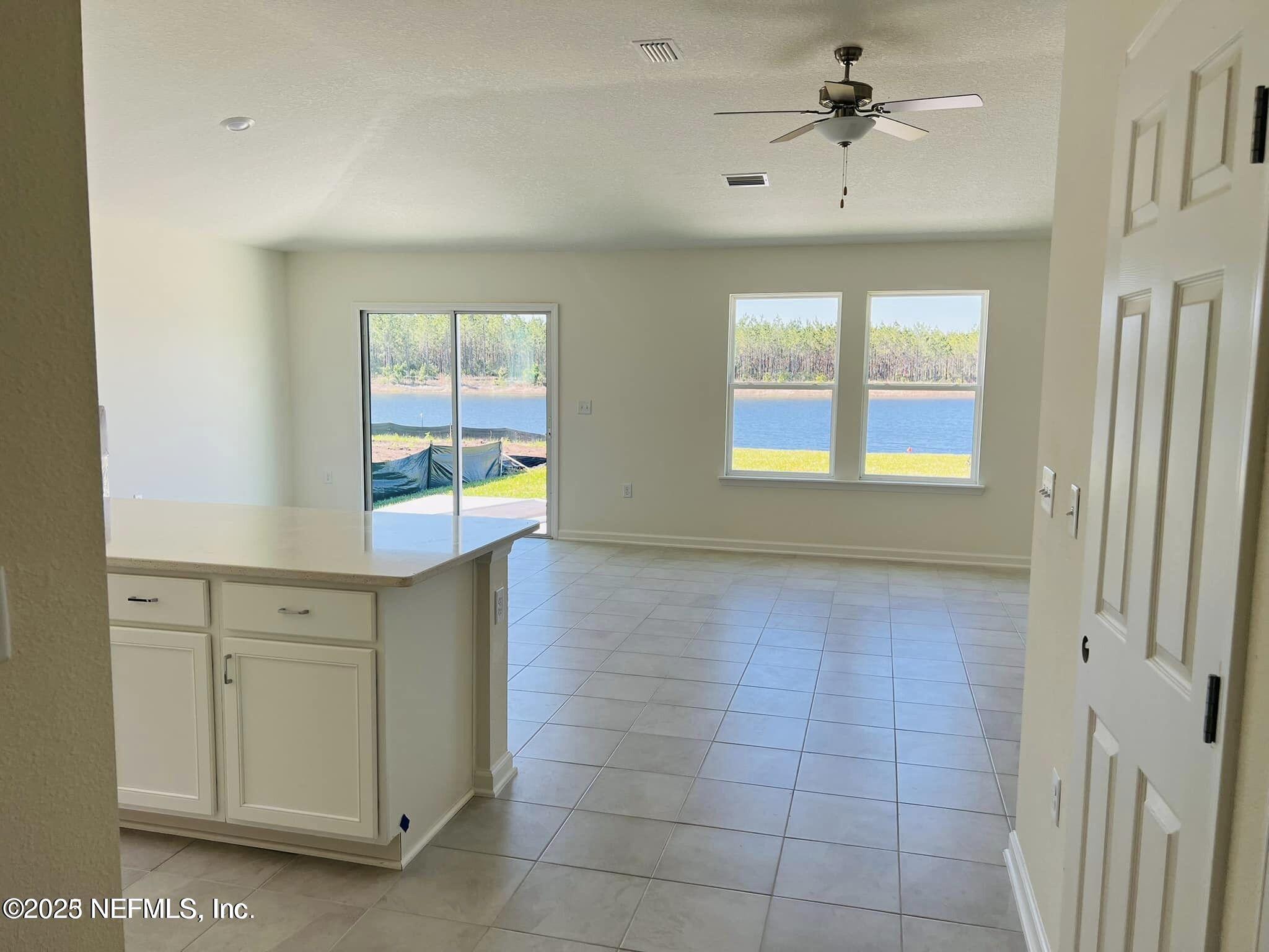 10961 Stapleton Drive Jacksonville, FL 32222 - Photo 4 of 13 a view of an empty room with a window