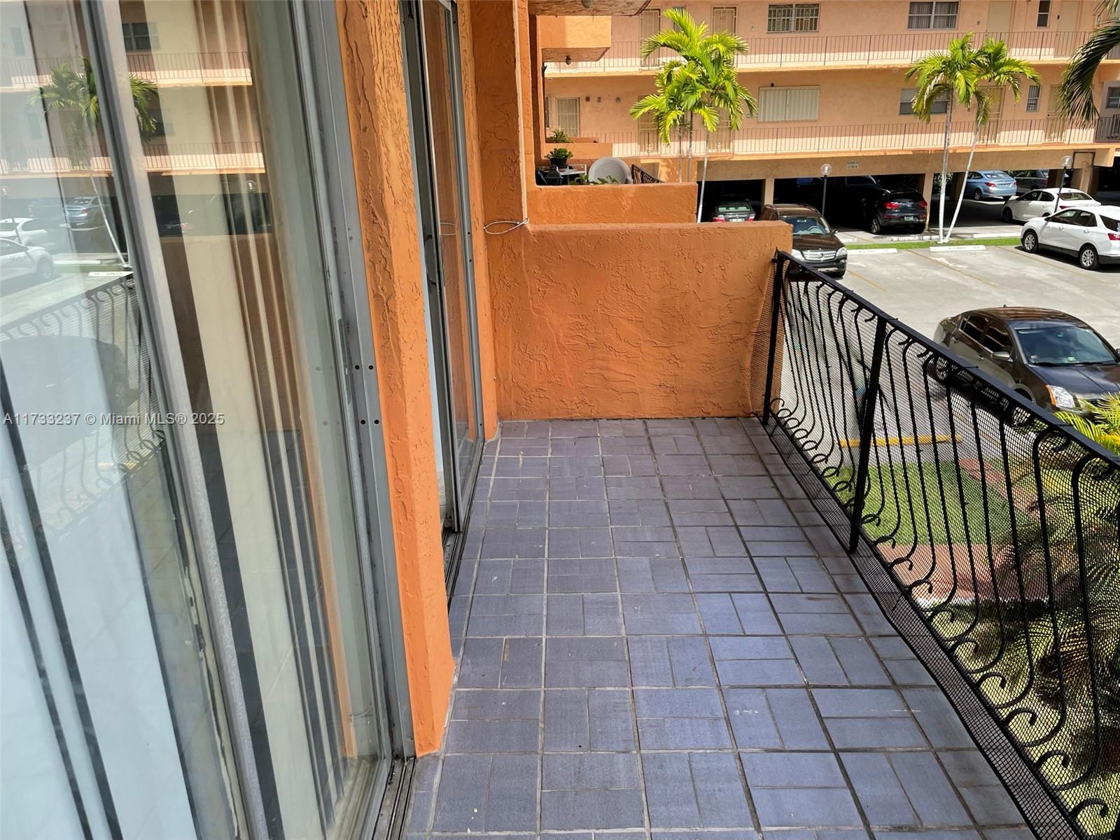 1950 West 54th Street, Unit 112 Hialeah, FL 33012 - Photo 12 of 27 a view of a patio with table and chairs