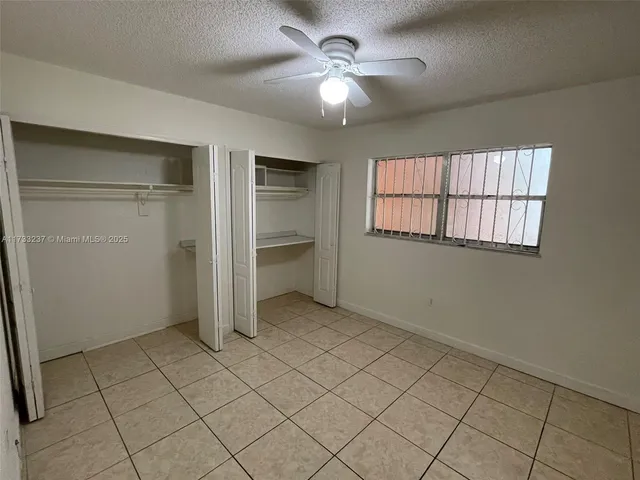 a bathroom with a toilet and a bath tub