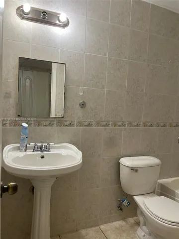 a bathroom with a sink and toilet