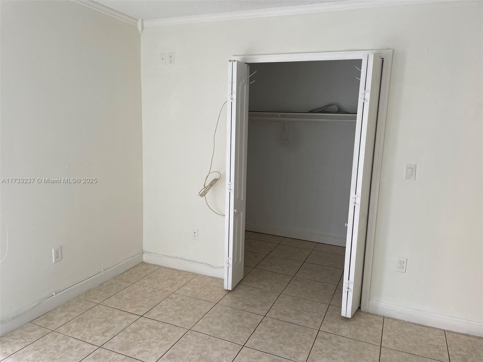 1950 West 54th Street, Unit 112 Hialeah, FL 33012 - Photo 19 of 27 an empty room with closet