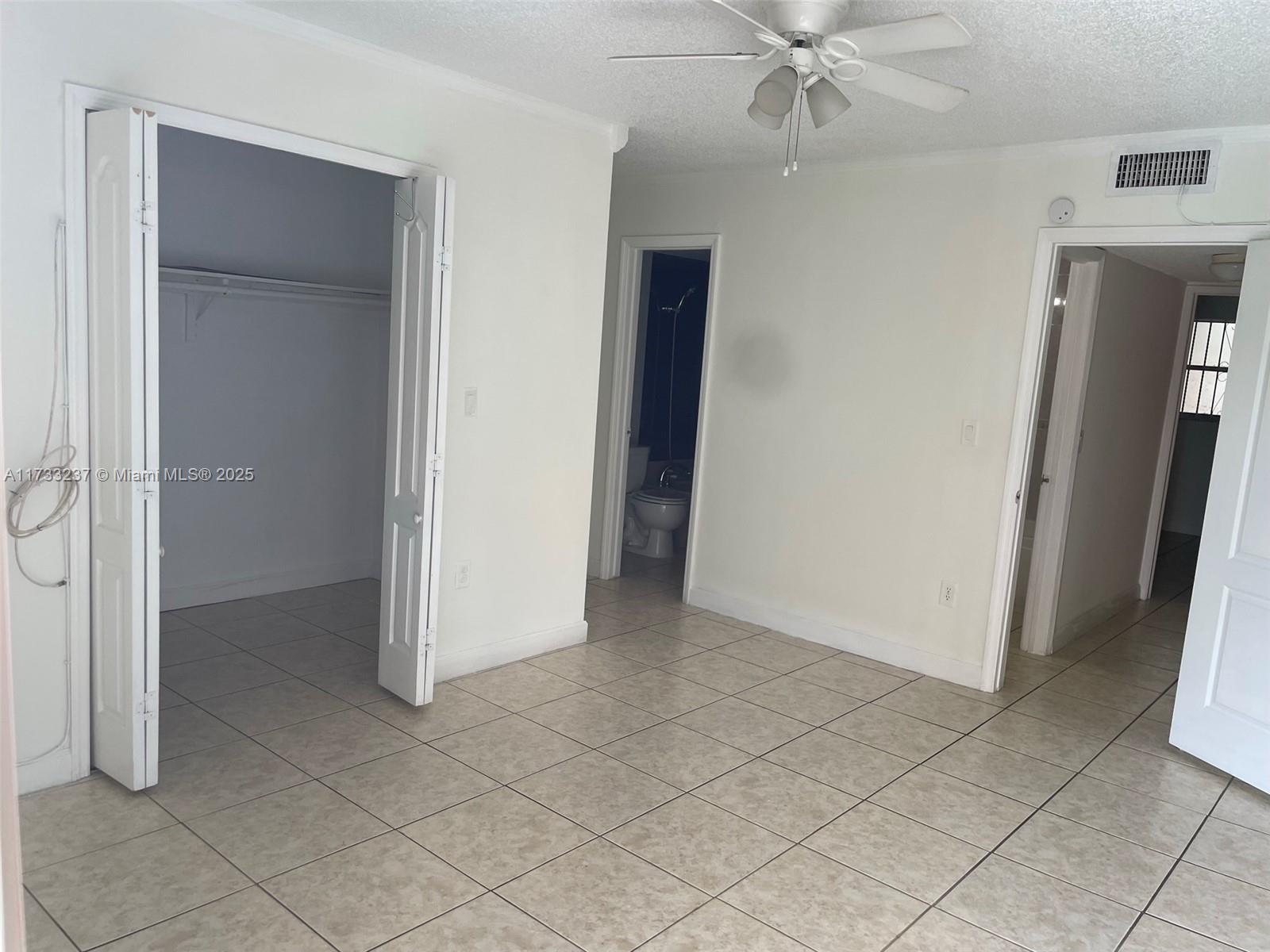 1950 West 54th Street, Unit 112 Hialeah, FL 33012 - Photo 21 of 27 a view of an empty room