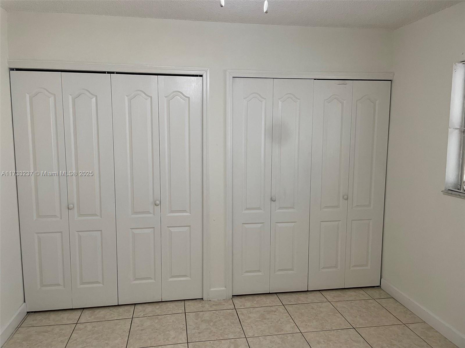 1950 West 54th Street, Unit 112 Hialeah, FL 33012 - Photo 23 of 27 a view of a closet