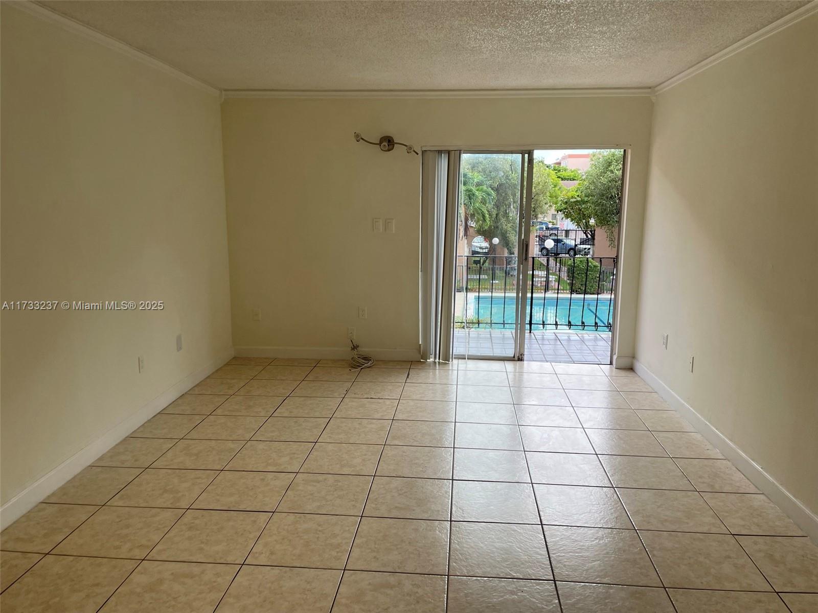 1950 West 54th Street, Unit 112 Hialeah, FL 33012 - Photo 8 of 27 a view of an empty room and window