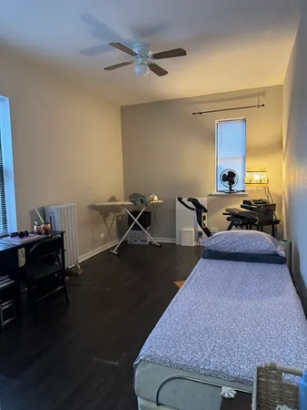 a living room with furniture rug and wooden floor