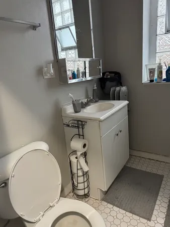 a room with a sink a washer and dryer