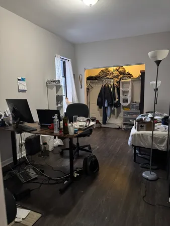 a living room with lots of furniture and a gym