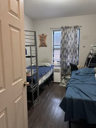 a bedroom with a bed and a closet