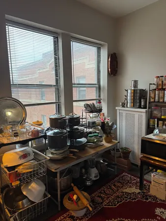 a living room with furniture and a lamp