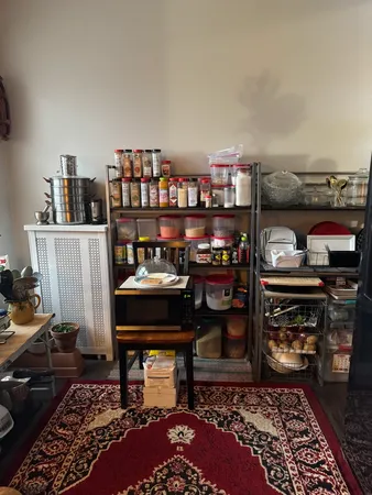 a living room with a couch and a bookshelf