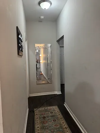 an entryway with wooden floor