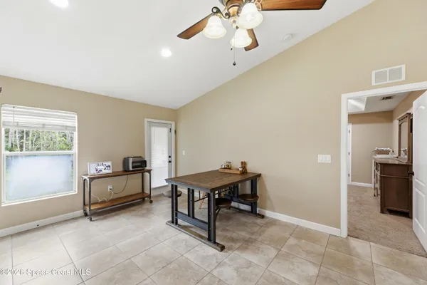 a view of a workspace with furniture