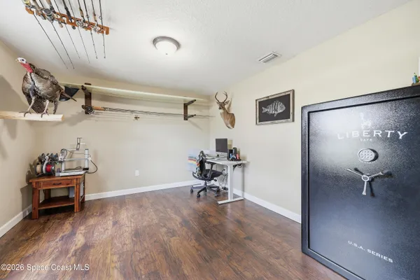 a view of a room that has a couch and a table in it