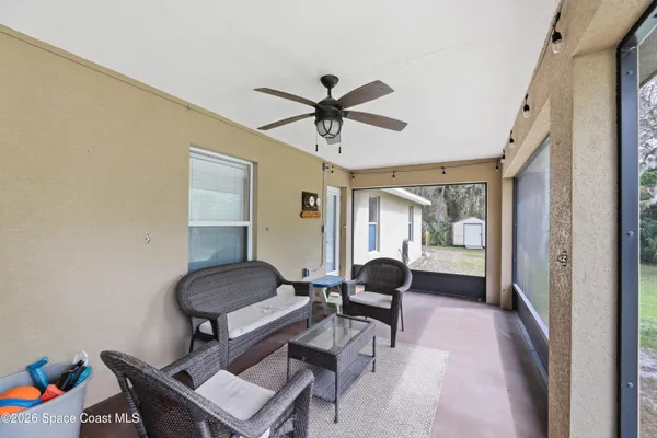 a living room with furniture and a window