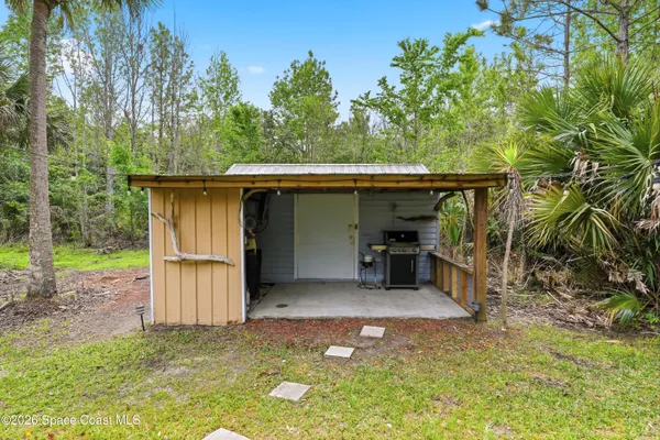 a view of a room with a patio and a yard