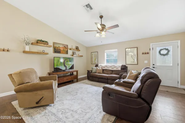 a living room with furniture or couch and a window