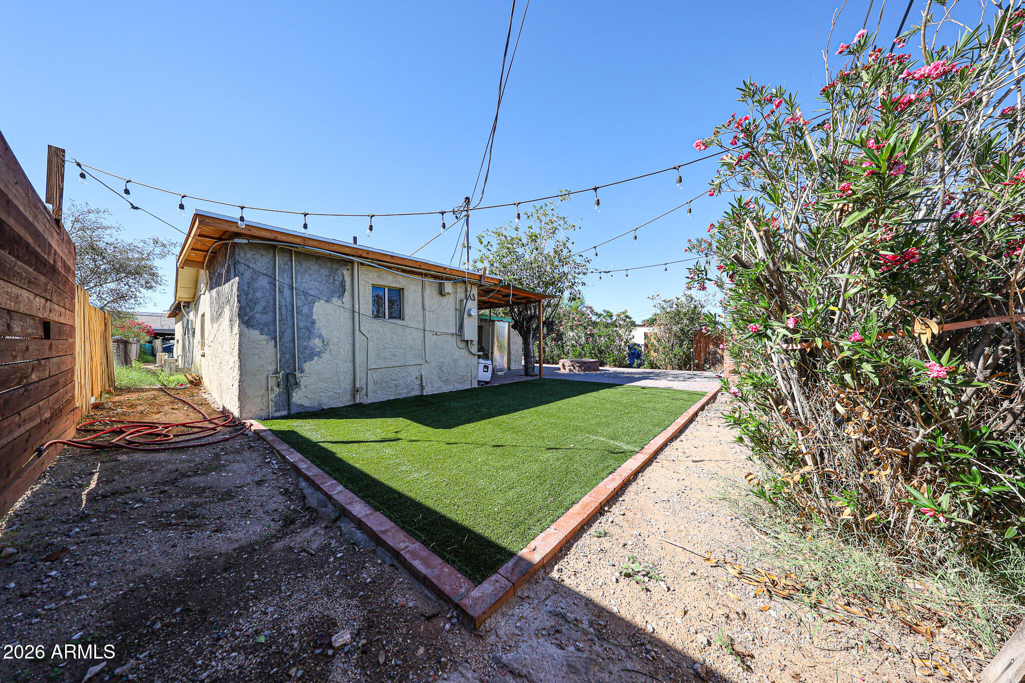 8223 C. Azteca Guadalupe, AZ 85283 - Photo 30 of 33 a view of a backyard with potted plants