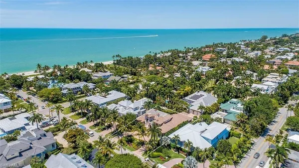 an aerial view of a houses with a lake view