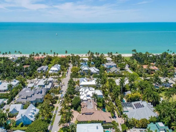 an aerial view of a houses with a yard