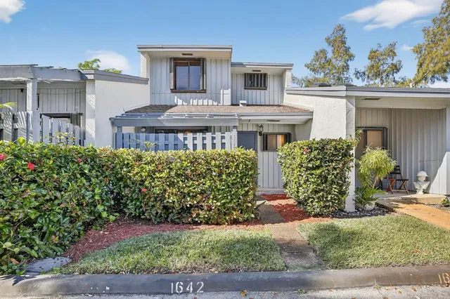 a view of a house with a garden