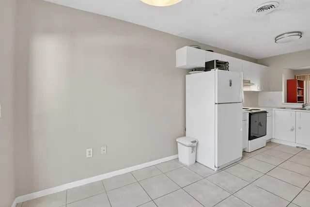 a dining room with furniture and chandelier