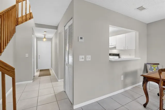 a bathroom with a sink mirror and toilet