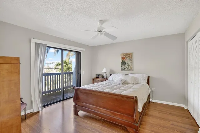 a bedroom with a bed and a flat tv screen